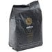 A black bag of Lavazza Single Origin Ethiopia Kafa Forest whole bean espresso coffee with a gold label.
