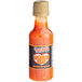 A bottle of Marie Sharp's Belizean Heat Habanero hot sauce with a label on it.