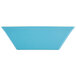A blue rectangular bowl with white edges.