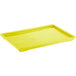 A yellow rectangular plastic tray lid.