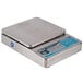 An Edlund Poseidon digital portion scale with a stainless steel body and blue screen.