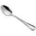 An Acopa stainless steel spoon with a curved handle.