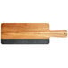 An Acacia wood serving board with a slate insert and a handle.