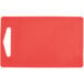 A red polyethylene cutting board with a handle.