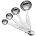 A close-up of three Choice stainless steel measuring spoons.