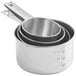 A stack of stainless steel measuring cups with the Choice logo on the handles.