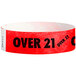 A red and white paper wristband with black "OVER 21" text.