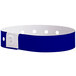 A navy blue wristband with white dots and holes.