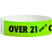 A green paper wristband with black text that says "OVER 21"