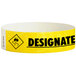 A yellow paper wristband with black text that reads "DESIGNATED DRIVER"