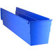 A Regency blue plastic shelf bin with two compartments.