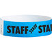 A blue paper wristband with black text that reads "STAFF"