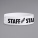 A white paper wristband with black text that reads "STAFF"