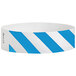 A close-up of a Carnival King blue and white striped paper wristband.