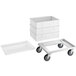 A white plastic dough proofing container with a white lid on a white metal dolly.