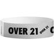 A white paper wristband with black text reading "OVER 21"