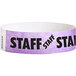 A light purple paper wristband with black "STAFF" text.