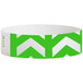 A white wristband with green chevron arrows.