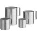 A group of silver aluminum measuring cups with handles.