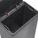 A Rubbermaid 12 gallon charcoal stainless steel step-on trash can with a lid open.