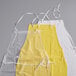 A pair of yellow and white Choice vinyl aprons with white straps.