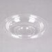 A clear Fineline plastic dome lid on a clear plastic bowl.