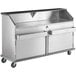 A Regency stainless steel portable bar with ice bin and speed rails.