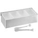 A Tablecraft stainless steel condiment bar with white plastic inserts and stainless steel tongs on a counter.