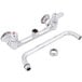 A chrome Equip by T&S wall mount faucet with 10 1/8" swing spout and lever handles.