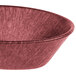 A raspberry polyethylene oval basket with a handle.