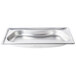 A Vollrath stainless steel kidney-shaped steam table pan on a counter.