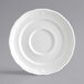 A white Acopa Condesa porcelain saucer with a scalloped edge.