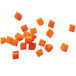 Cubes of orange food created with a Robot Coupe 27265 Dicing Kit.