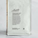 A white bag of Arrosto Mexican Altura Mountain Water Decaf Whole Bean Coffee with leaves and text.
