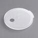 A white plastic round lid with a hole in the center.