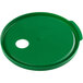A green plastic lid with a hole for a condiment pump.