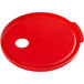 A red round lid with a hole in it.