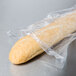 A baguette wrapped in an LK Packaging plastic bag.