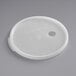 A white translucent plastic round lid with a hole in it.