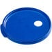 A blue plastic round lid with a hole in it.