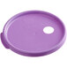A round purple plastic lid with a hole in it.