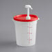 A white and red plastic container with a red lid and a pump.