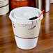 A Solo Symphony foam cup with a lid and a straw.