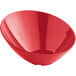 An Acopa red melamine bowl with a slanted edge on a white background.