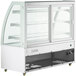 A white Avantco curved glass dry bakery display case with three shelves.