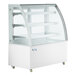 A white Avantco refrigerated bakery display case with curved glass doors and shelves.
