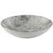 A white bowl with a steel grey speckled surface.