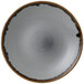 A Dudson Harvest grey china plate with a black center and rim.