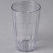 A clear Cambro plastic tumbler with a small hole in the middle.