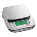 A stainless steel AvaWeigh digital portion scale on a counter with a digital display.